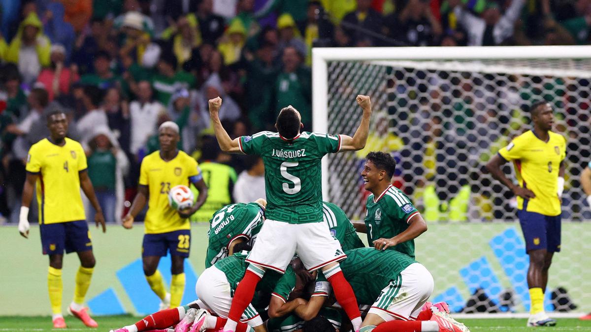 Mexico's Raul Jimenez celebrates scoring their second goal with Johan Vasquez and teammates next as Ecuador players look dejected. | Photo Credit: Reuters